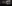 Installationsfoto af kvinde foran to skærme, der viser billeder fra tidligere KZ lejr