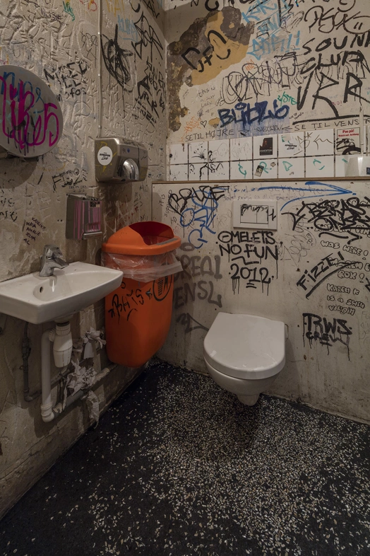 public bathroom with graffiti